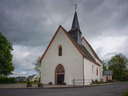 Panoramic image of the pilgrim church Maria and Maria Magdalena of Valwigerberg with cloudy sky, Cochem, Germanyの写真素材