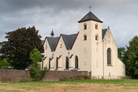 Panoramic image of the old parish church of Cologne Duennwald on a cloudy day, Germanyの写真素材