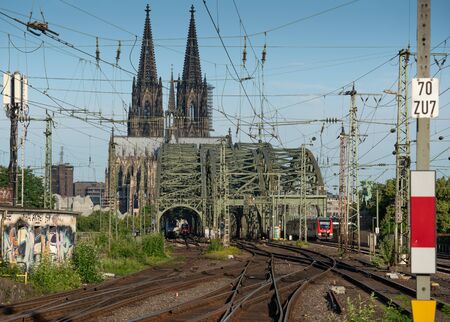 COLOGNE, GERMANY - JUNE 14, 2019: Urban infrastructure, railway system with the Cologne cathedral in the background on June 14, 2019 in Germanyのeditorial素材