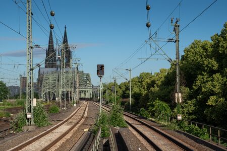 COLOGNE, GERMANY - JUNE 13, 2019: Urban infrastructure, railway system with the Cologne cathedral in the background on June 13, 2019 in Germanyのeditorial素材