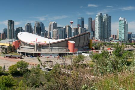 CALGARY, CANADA - AUGUST 5, 2019: Panoramic image of the skyline of Calgary with the Saddledom in the foreground on August 5, 2019 in Alberta, Canadaのeditorial素材