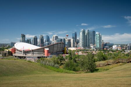 CALGARY, CANADA - AUGUST 5, 2019: Panoramic image of the skyline of Calgary with the Saddledom in the foreground on August 5, 2019 in Alberta, Canadaのeditorial素材