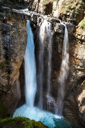 Longexposure image of a waterfall within the Johnston Canyon, Bow Valley Parkway, Banff National Park, Alberta, Canadaの写真素材