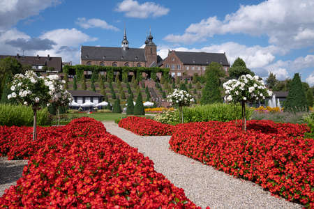 KAMP-LINTFORT, GERMANY - AUGUST 22, 2020: Panoramic image of monastery Kamp with blooming flowers against cloudy sky on August 22, 2020 in Germanyのeditorial素材