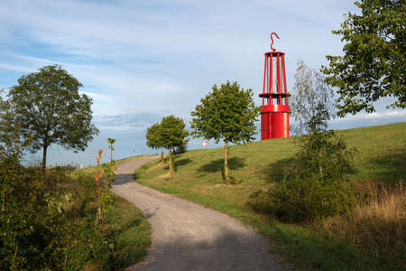 MOERS, GERMANY - AUGUST 22, 2020: Mine lamp, landmark of Ruhr Metropolis on top of Rheinpreussen tip against sunset on August 22, 2020 in Moers, Germanyのeditorial素材
