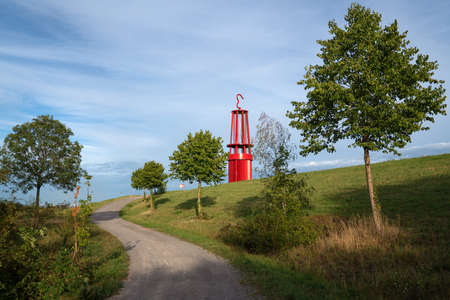 MOERS, GERMANY - AUGUST 22, 2020: Mine lamp, landmark of Ruhr Metropolis on top of Rheinpreussen tip against sunset on August 22, 2020 in Moers, Germanyのeditorial素材