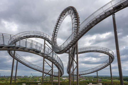 DUISBURG, GERMANY - AUGUST 29, 2020: Tiger and Turtle, landmark of Ruhr Metropolis against sky on August 29, 2020 in Duisburg, Germanyのeditorial素材