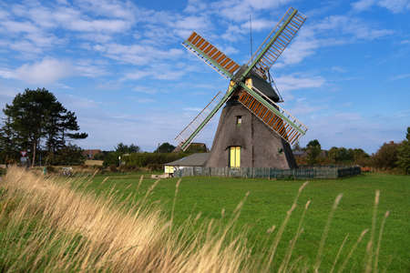 Panoramic image of the windmill of Nebel against blue sky, Amrum, Germanyの写真素材
