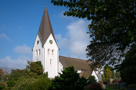 Old church of Nebel against blue sky, Amrum, Germanyの写真素材