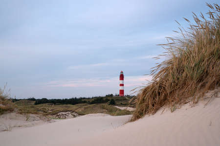 Panoramic image of the Wittduen lighthouse at sunset, Amrum, Germanyの写真素材
