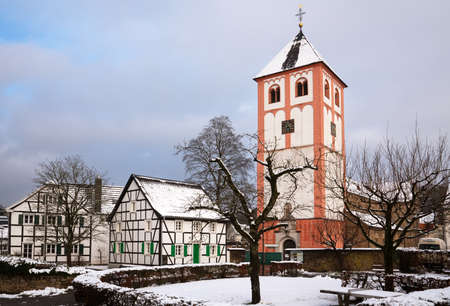 ODENTHAL, GERMANY - JANUARY 24, 2021: Center of village Odenthal with parish church and old buildings on a winter day on January 24, 2021 in Germanyのeditorial素材