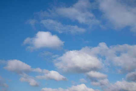 Low angle view to sky with fleecy cloudsの写真素材