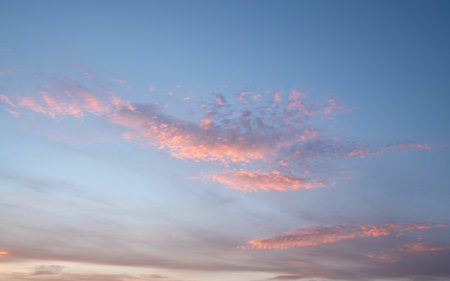 Evening sky with pastel-colored cloudsの写真素材