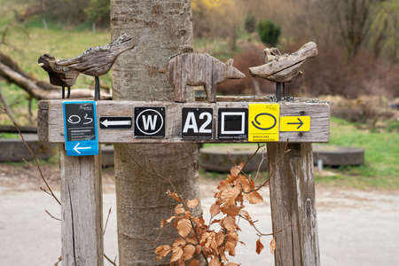 WERMELSKIRCHEN, GERMANY - APRIL 2, 2021: Long distance hiking trail Bergischer Panoramasteig with focus on the typical waymark on April 2, 2021 in Germanyのeditorial素材