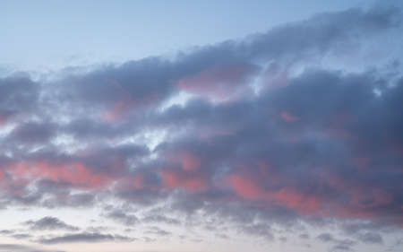 Evening sky with pastel-colored cloudsの写真素材