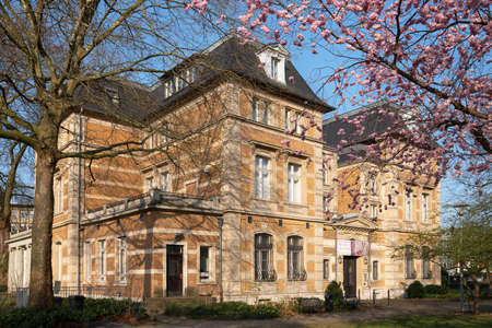 BERGISCH GLADBACH, GERMANY - MARCH 21, 2022: Villa Zanders with blooming cherry tree at springtime, landmark of Bergisch Gladbach on March 21, 2022 in North Rhine Westphalia, Germanyのeditorial素材