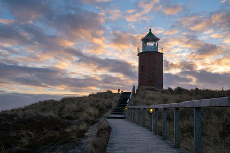 Panoramic image of Kampen lighthouse against evening sky, Sylt, North Frisia, Germanyの写真素材