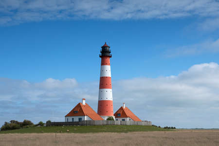 Panoramic image of Westerhever lighthouse against sky, North Frisia, Germanyの写真素材