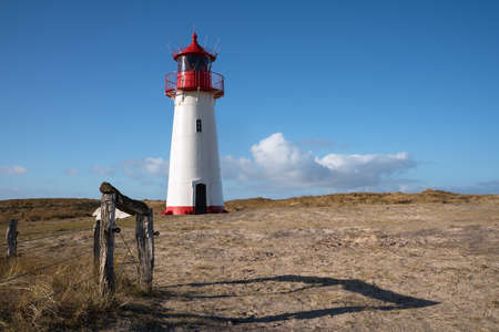 Panoramic image of List West lighthouse against blue sky, Sylt, North Frisia, Germanyの写真素材