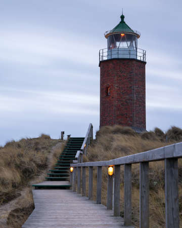 Panoramic image of Kampen lighthouse against evening sky, Sylt, North Frisia, Germanyの写真素材