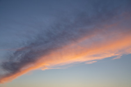 Evening sky with pastel-colored cloudsの写真素材