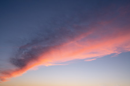 Evening sky with pastel-colored cloudsの写真素材