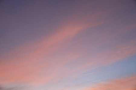 Evening sky with pastel-colored cloudsの写真素材