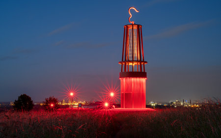 MOERS, GERMANY - JUNE 11, 2022: Mine lamp, illuminated landmark of Ruhr Metropolis on top of Rheinpreussen tip on June 11, 2022 in Moers, Germanyのeditorial素材