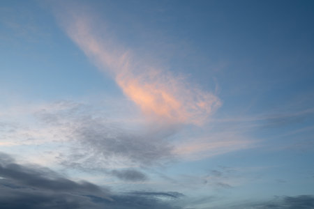 Evening sky with pastel-colored cloudsの写真素材