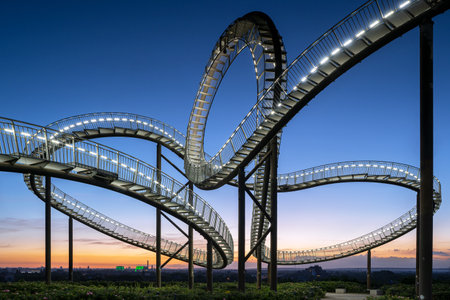 DUISBURG, GERMANY - JUNE 12, 2022: Tiger and Turtle, landmark of Ruhr Metropolis against sky on June 12, 2022 in Duisburg, Germanyのeditorial素材