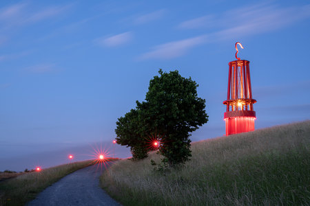 MOERS, GERMANY - JUNE 11, 2022: Mine lamp, illuminated landmark of Ruhr Metropolis on top of Rheinpreussen tip on June 11, 2022 in Moers, Germanyのeditorial素材