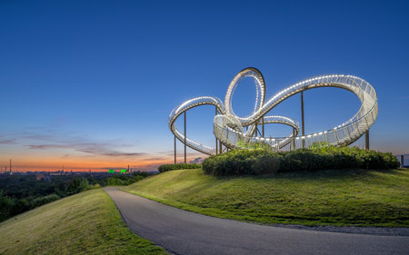 DUISBURG, GERMANY - JUNE 12, 2022: Tiger and Turtle, landmark of Ruhr Metropolis against sky on June 12, 2022 in Duisburg, Germanyのeditorial素材