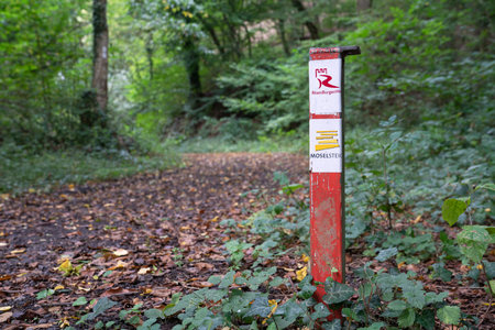 WINNINGEN, GERMANY - SEPTEMBER 29, 2021: Long distance Rhine Castle hiking trail and Mosel hiking trail with focus on the typical waymark on September 29, 2021 in Germanyのeditorial素材