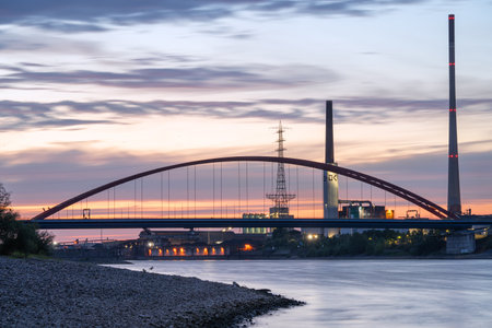 DUISBURG, GERMANY - JULY 13, 2022: Industrial area close to Rhine River during Sunset on July 13, 2022 in Duisburg, Ruhr Metropolis, Germanyのeditorial素材