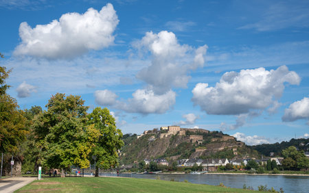 KOBLENZ, GERMANY - SEPTEMBER 30, 2021: Panoramic image of Ehrenbreitstein fortress close to the Rhine river with white clouds on September 30, 2021 in Koblenz, Germanyのeditorial素材