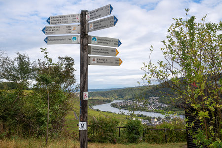 WINNINGEN, GERMANY - SEPTEMBER 29, 2021: Long distance hiking trails Moselsteig and Rhine Castle trail with focus on the typical waymarks on September 29, 2021 in Germanyのeditorial素材