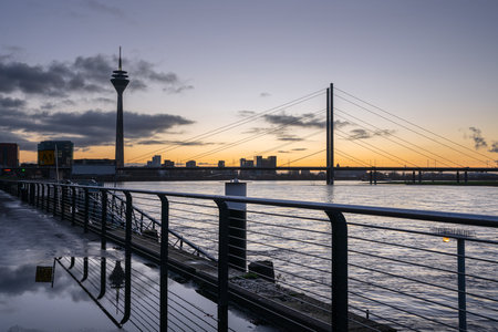 DUSSELDORF, GERMANY - DECEMBER 25, 2020: Colorful sunset on the Rhine river with the cityscape of Dusseldorf in the background on December 25, 2020 in Germanyのeditorial素材