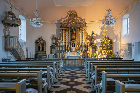 LEVERKUSEN, GERMANY - JANUARY 3, 2023: View throught the main aisle of the parish church Saint Stephanus on January 3, 2023 in Leverkusen, Germanyのeditorial素材