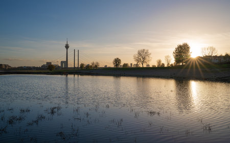 Sunset on the Rhine river with the cityscape of Dusseldorf in the background, Germanyの写真素材