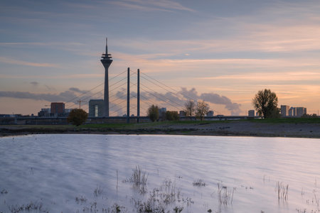 Sunset on the Rhine river with the cityscape of Dusseldorf in the background, Germanyの写真素材