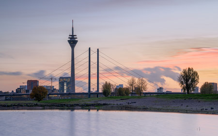Sunset on the Rhine river with the cityscape of Dusseldorf in the background, Germanyの写真素材