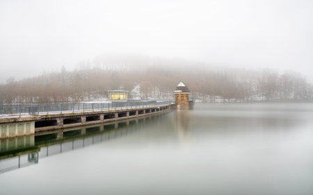 Panoramic image of Lister lake on a foggy winter day, Sauerland, Germanyの写真素材