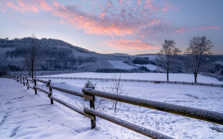 Panoramic image of winter landscape during sunrise, Schmallenberg, Sauerland, Germanyの写真素材