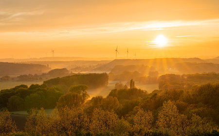 Evening mood, hills of Lower Rhine during sunset with evening fog, North Rhine Westphalia, Germanyの写真素材