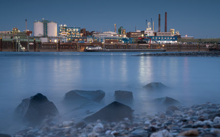 LEVERKUSEN, GERMANY - MARCH 1, 2023: Industrial area of Chempark Leverkusen close to Rhine River during Sunset on March 1, 2023 in North Rhine Westphalia, Germanyのeditorial素材