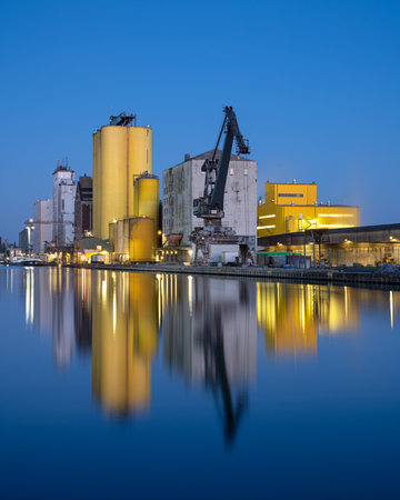 HAMM, GERMANY - FEBRUARY 28, 2023: Port of Hamm during blue hour with water reflection on February 28, 2023 in Germanyのeditorial素材