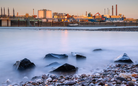LEVERKUSEN, GERMANY - MARCH 1, 2023: Industrial area of Chempark Leverkusen close to Rhine River during Sunset on March 1, 2023 in North Rhine Westphalia, Germanyのeditorial素材