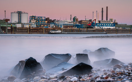 LEVERKUSEN, GERMANY - MARCH 1, 2023: Industrial area of Chempark Leverkusen close to Rhine River during Sunset on March 1, 2023 in North Rhine Westphalia, Germanyのeditorial素材