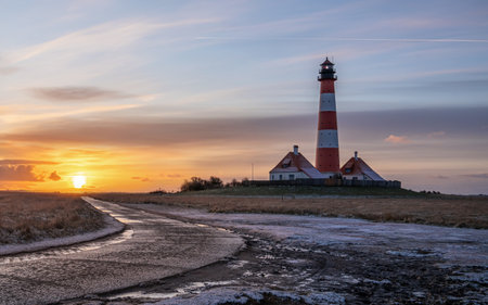 Panoramic image of Westerhever lighthouse against sky, North Frisia, Germanyの写真素材