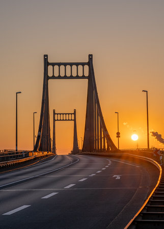 Old bridge crossing the Rhine river during sunrise, Krefeld, North Rhine Westphalia, Germanyの写真素材